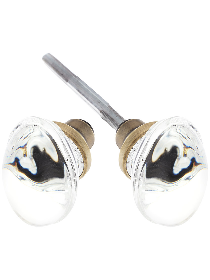 Pair of Oval Clear Crystal Knobs in Antique Brass.